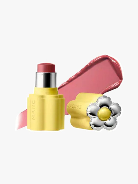 Yellow tube of Marc Jacobs Beauty Joystick Blush Stick on a light gray background